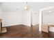 Bright living room with hardwood floors, a brick fireplace, and a built-in desk at 6130 Desert Sun Dr, Las Vegas, NV 89110