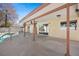 Covered patio next to a in-ground pool, offering a perfect blend of comfort and style at 6130 Desert Sun Dr, Las Vegas, NV 89110