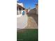 Backyard with a concrete patio, rock landscaping, and artificial turf at 6717 Sheffield Dr, Las Vegas, NV 89108