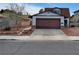 Charming home featuring a two-car garage, a cozy front yard, and an inviting entrance at 6717 Sheffield Dr, Las Vegas, NV 89108