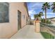 Balcony with iron railing and stucco walls offers relaxing outdoor space and bright sky views at 6938 Silk Oak Ct, Las Vegas, NV 89148