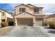 Lovely two-story home featuring a three-car garage and well-kept front yard at 6938 Silk Oak Ct, Las Vegas, NV 89148