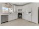 Bright kitchen featuring modern white cabinets, stainless steel appliances, and a large window at 6938 Silk Oak Ct, Las Vegas, NV 89148