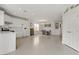 Open-concept kitchen and dining area with bright tile flooring and modern appliances at 6938 Silk Oak Ct, Las Vegas, NV 89148