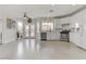 Bright kitchen with white cabinetry, stainless steel appliances, and access to the backyard at 6938 Silk Oak Ct, Las Vegas, NV 89148