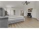 Expansive main bedroom with wood floors, vaulted ceiling, and ensuite bathroom at 6938 Silk Oak Ct, Las Vegas, NV 89148