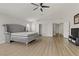 Large main bedroom with wood floors, ceiling fan, and multiple closets at 6938 Silk Oak Ct, Las Vegas, NV 89148