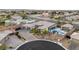 Aerial view of a home with a three-car garage, a pool and backyard patio at 7165 N Grand Canyon Dr, Las Vegas, NV 89149