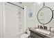 Bathroom with granite sink and white shower with a bathtub and chrome fixtures at 7165 N Grand Canyon Dr, Las Vegas, NV 89149