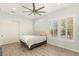 Neutral bedroom with a ceiling fan, dual closets and shuttered windows at 7165 N Grand Canyon Dr, Las Vegas, NV 89149