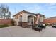 Cozy backyard patio with stucco walls, a pergola, and outdoor seating perfect for entertaining at 7165 N Grand Canyon Dr, Las Vegas, NV 89149