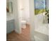 This secondary bathroom features a toilet and a peek at double sinks at 7444 Grassy Field Ct, Las Vegas, NV 89131