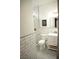 Bright bathroom features white subway tile, hexagon tile floor and modern vanity at 7444 Grassy Field Ct, Las Vegas, NV 89131