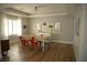 Inviting dining room featuring a large table, stylish chairs, and tray ceiling at 7444 Grassy Field Ct, Las Vegas, NV 89131