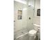 Bright bathroom showcases shower with white subway tile and built-in shelving at 7444 Grassy Field Ct, Las Vegas, NV 89131