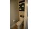 This toilet features an elegant wreath, wooden floors, and neutral colored walls at 7444 Grassy Field Ct, Las Vegas, NV 89131