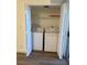 Laundry area features a washer and dryer, shelves, and laminate floors at 800 N Torrey Pines Dr, Las Vegas, NV 89107