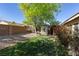 Well-maintained backyard featuring a storage shed, lush lawn, and decorative rock landscaping at 8213 Cabin Springs Ave, Las Vegas, NV 89131