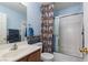 Charming bathroom with nautical-themed decor, vanity, and a shower/tub combo at 8213 Cabin Springs Ave, Las Vegas, NV 89131