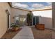 Inviting courtyard featuring a bench and wood planter boxes leads to the home's double-door entrance at 8213 Cabin Springs Ave, Las Vegas, NV 89131