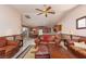 Open floor plan with a living room leading into a kitchen, featuring tile flooring and traditional furnishings at 8213 Cabin Springs Ave, Las Vegas, NV 89131