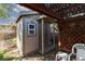 Backyard storage shed with lattice-covered patio, providing additional storage and outdoor space at 8213 Cabin Springs Ave, Las Vegas, NV 89131