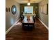 Well-lit dining room with wood-look floors, designer furnishings, and decorative accents at 8558 Rumsfield Ct, Las Vegas, NV 89131