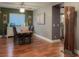 Dining room featuring hardwood floors, a modern table, and stylish decor at 8558 Rumsfield Ct, Las Vegas, NV 89131