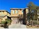 Two-story home with a two car garage and desert landscaping at 8558 Rumsfield Ct, Las Vegas, NV 89131