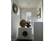 Upstairs hallway with white walls, a white cabinet, and a decorative gold mirror at 8558 Rumsfield Ct, Las Vegas, NV 89131