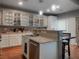 Bright kitchen featuring stainless steel appliances, granite countertops, and an island with a sink at 8558 Rumsfield Ct, Las Vegas, NV 89131