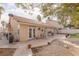 Backyard patio features tile flooring, wrought iron fence, and barbecue island at 8736 Vista Ladera Ct, Las Vegas, NV 89147