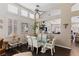 Cozy dining area showcasing plantation shutters and views into other living spaces at 8736 Vista Ladera Ct, Las Vegas, NV 89147