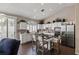 Well-lit kitchen featuring white cabinets, stainless steel appliances, and a center island with seating at 8736 Vista Ladera Ct, Las Vegas, NV 89147