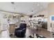 Bright kitchen area with stainless steel appliances, white cabinetry, and a functional center island at 8736 Vista Ladera Ct, Las Vegas, NV 89147