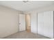 Bedroom featuring carpet, neutral walls, and sliding closet doors for storage at 8805 Pavia Dr, Las Vegas, NV 89117