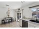 Dining area with a view to the kitchen and outdoor patio at 8805 Pavia Dr, Las Vegas, NV 89117