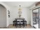 Bright dining area with seating for four and sliding glass doors to the backyard at 8805 Pavia Dr, Las Vegas, NV 89117