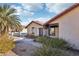 Angle exterior shot of a home, featuring a tiled roof, landscaping and desert plants at 8805 Pavia Dr, Las Vegas, NV 89117