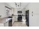 Bright kitchen with stainless steel appliances, granite countertops, and ample cabinet space at 8805 Pavia Dr, Las Vegas, NV 89117