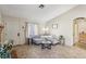 Cozy living room with neutral paint, tile floors, comfortable seating, natural light and front door at 8805 Pavia Dr, Las Vegas, NV 89117