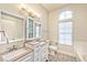 Bright bathroom with dual sinks, updated fixtures and a large window at 9002 Purple Leaf St, Las Vegas, NV 89123