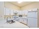 Bright kitchen with white cabinets, updated countertops and stainless steel sink at 9002 Purple Leaf St, Las Vegas, NV 89123