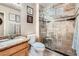 Cozy bathroom featuring a glass shower and granite countertop at 9071 Ravenhurst St, Las Vegas, NV 89123