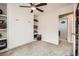 Bedroom with carpeted floors, built-in shelving, and Murphy bed at 9071 Ravenhurst St, Las Vegas, NV 89123