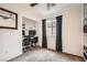 Bedroom featuring two workstations, shelving, and a ceiling fan at 9071 Ravenhurst St, Las Vegas, NV 89123