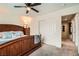 Bedroom showcasing a wood-frame bed, ceiling fan, closet, and carpeted floors at 9071 Ravenhurst St, Las Vegas, NV 89123