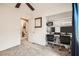 Bedroom featuring carpeted floors, built-in shelves, and a workstation at 9071 Ravenhurst St, Las Vegas, NV 89123