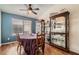 Charming dining area with a window and elegant china cabinets at 9071 Ravenhurst St, Las Vegas, NV 89123