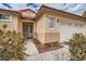 Close up of the front of the house featuring well kept yard and two car garage at 9071 Ravenhurst St, Las Vegas, NV 89123